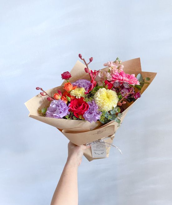 Marigold, Orchids, Rose, Ranunculus, Anethum, Astrantia in Wrapped Bouquet