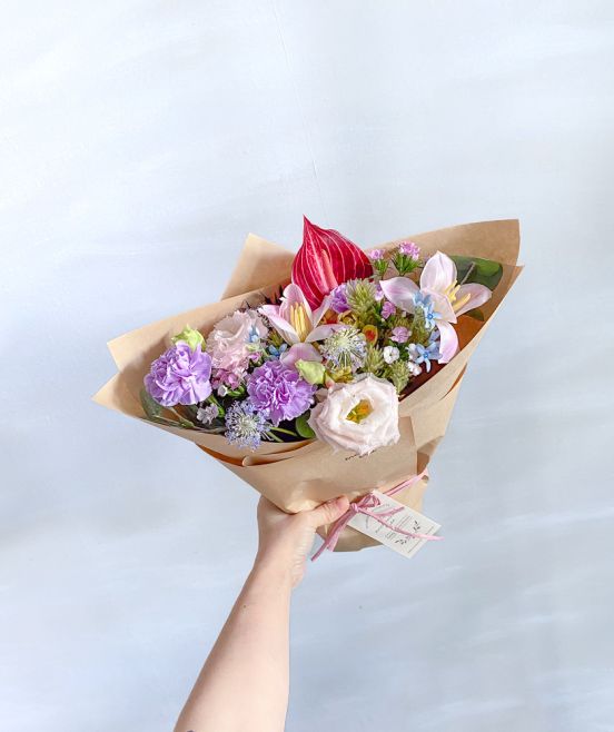 Rhoslyn Roses, Astilbe, White Tulips, Didiscus in Wrapped Bouquet